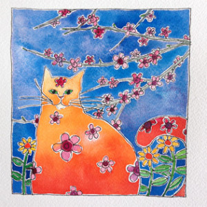 An orange cat sitting amongst the spring blossoms with a blue sky backdrop